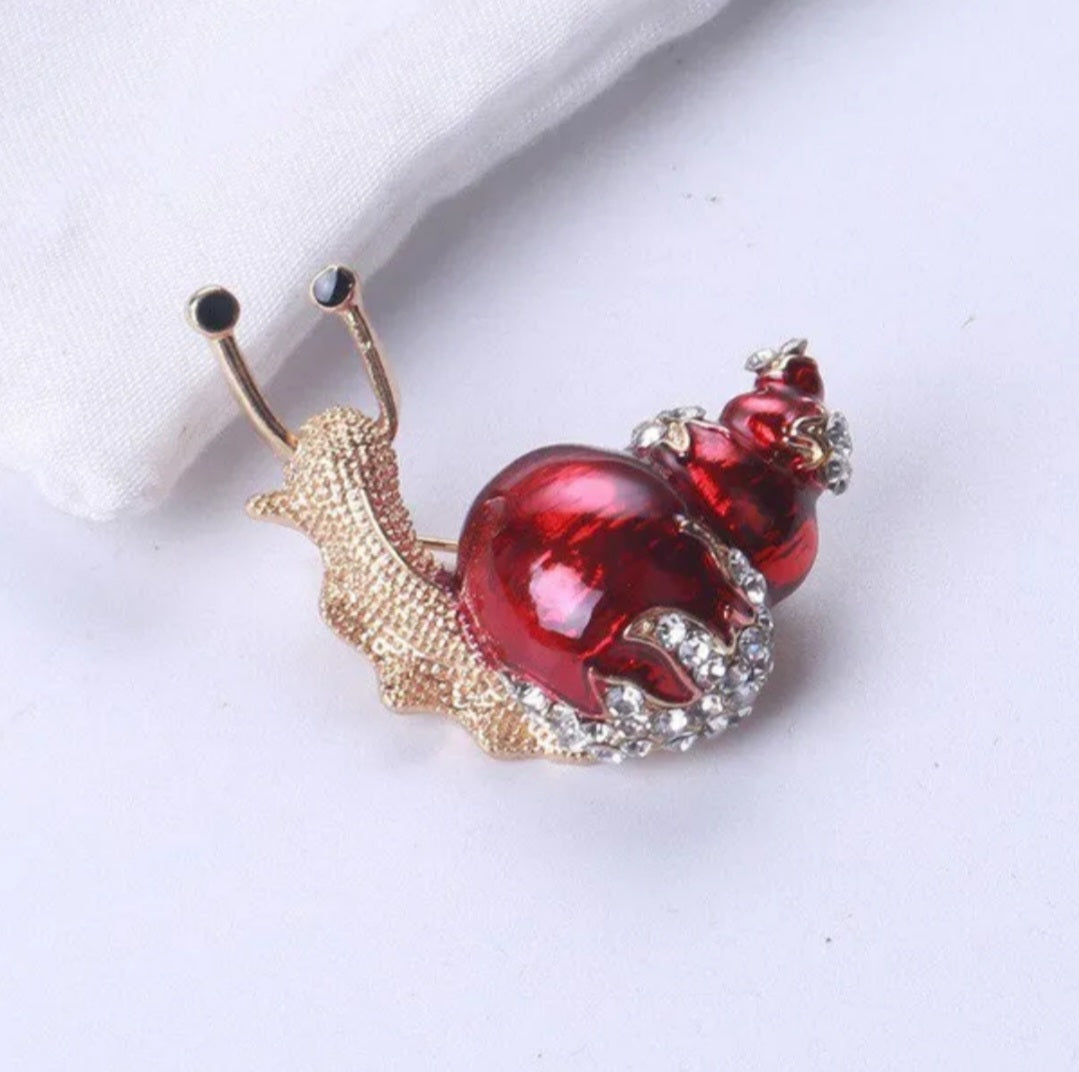 bijoux fantaisie, broches. divers coloris.